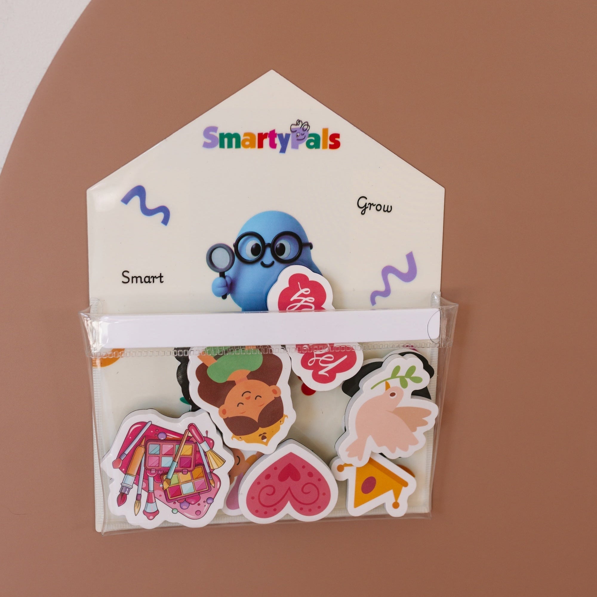 Child playing with SmartyPals magnetic sets as part of a calm back-to-routine day after the school holidays